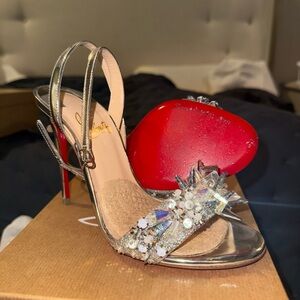 Christian Louboutin Metallic Silver Heels with Red Soles